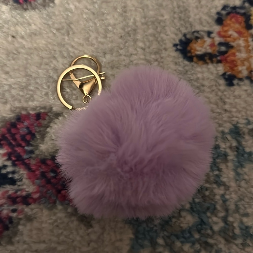 Pink//purple fuzz ball with gold key loop keychain